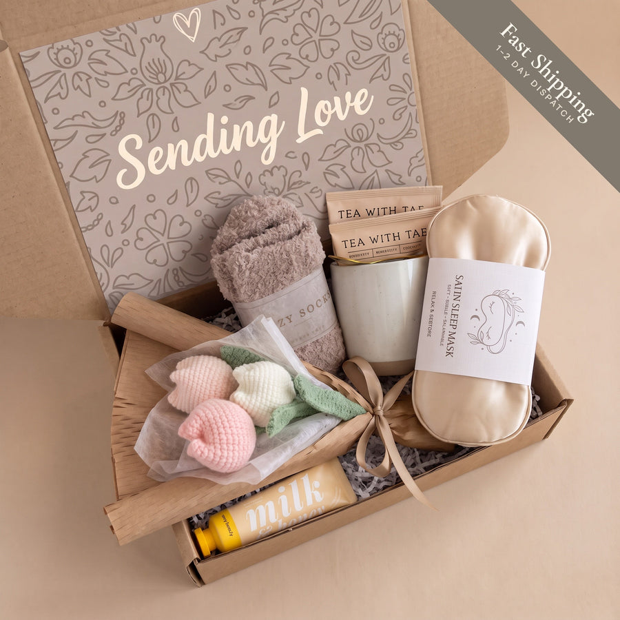 Hug in a box thinking of you gift box with crochet tulip bouquet, mug, tea, socks, sleep mask and hand cream